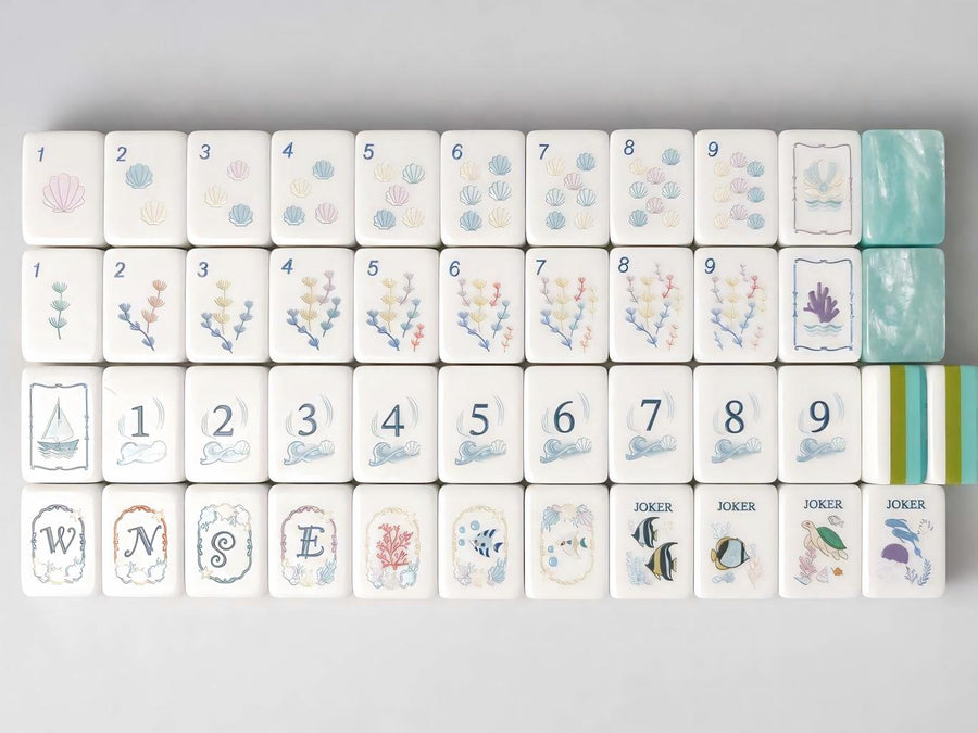 Dreamtide mahjong tile faces arranged in rows with pale pink, blue and lavender illustrations