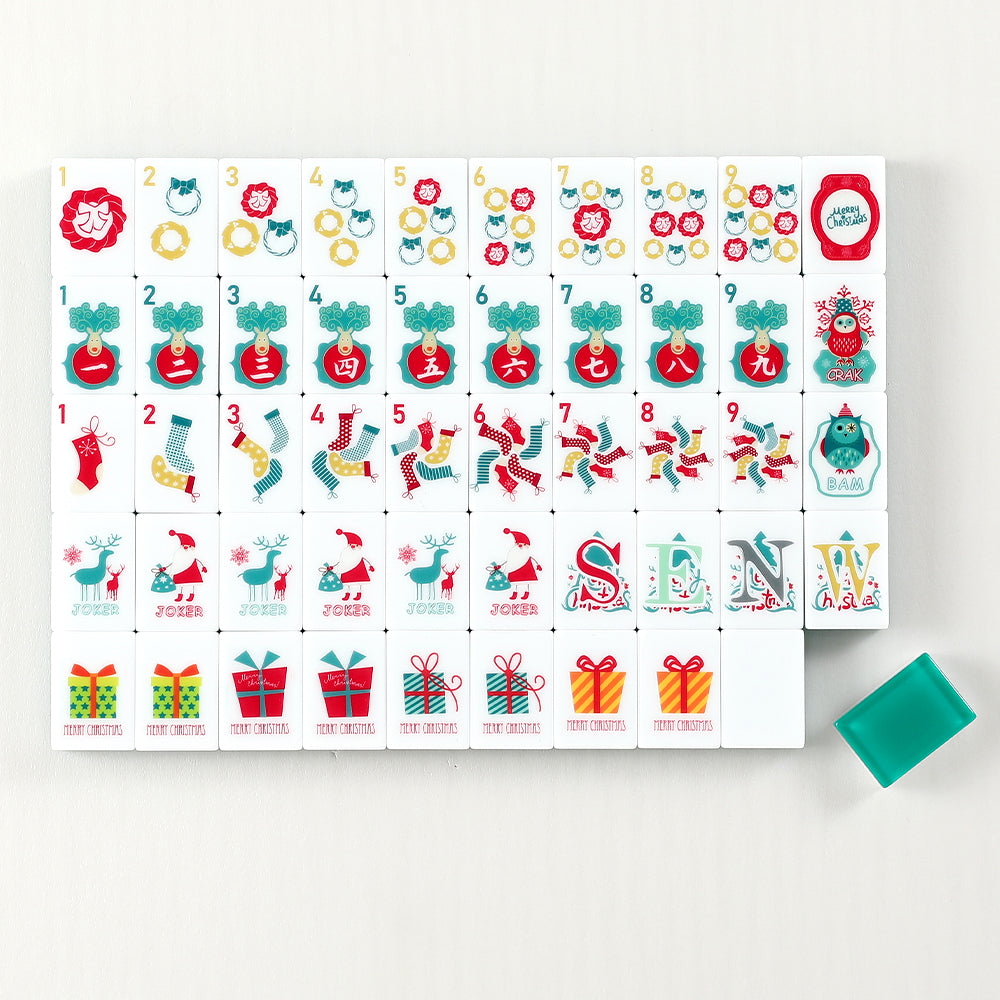 Hearthside mahjong tile faces with Christmas wreaths, stockings and gifts arranged in rows